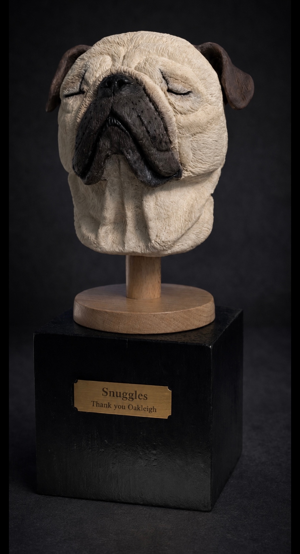 Hand-sculpted clay sculpture of Snuggles the pug