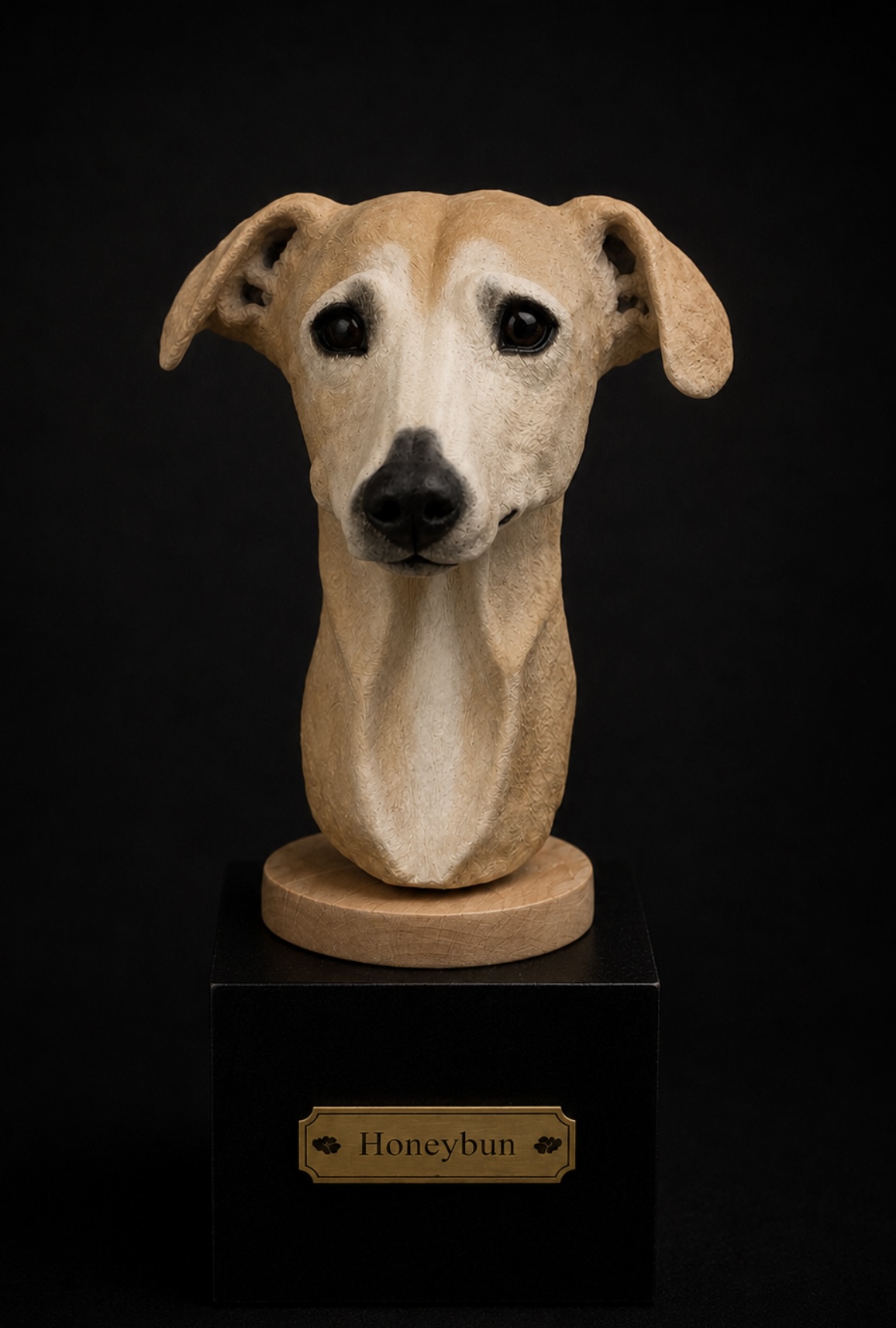 Hand-sculpted clay bust sculpture of Honey the whippet on a plinth with brass name plaque